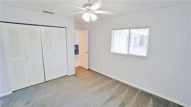 2780 39th St SW, Naples, FL 34117 - unfurnished bedroom with a closet, carpet floors, and a ceiling fan
