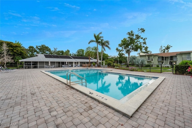 7400 College Pkwy Unit 61B, Fort Myers, FL 33907 - community pool featuring a patio