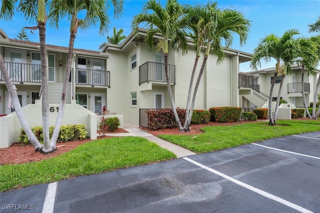 7400 College Pkwy Unit 61B, Fort Myers, FL 33907 - view of property with uncovered parking