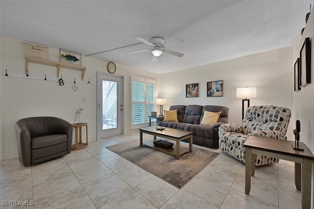 7400 College Pkwy Unit 61B, Fort Myers, FL 33907 - living room with light marble finish floors, a ceiling fan, and a textured ceiling