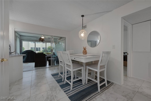 7400 College Pkwy Unit 61B, Fort Myers, FL 33907 - dining area featuring light marble finish flooring and baseboards