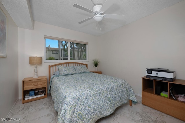 7400 College Pkwy Unit 61B, Fort Myers, FL 33907 - bedroom with marble finish floors, baseboards, a textured ceiling, and a ceiling fan