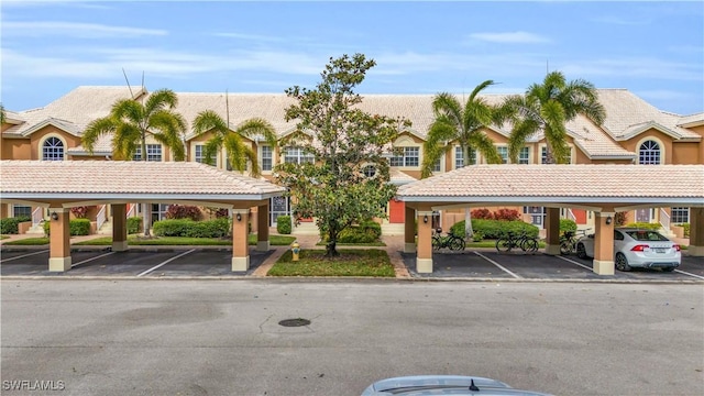 28076 Cavendish Ct Unit 2107, Bonita Springs, FL 34135 - view of property featuring covered parking