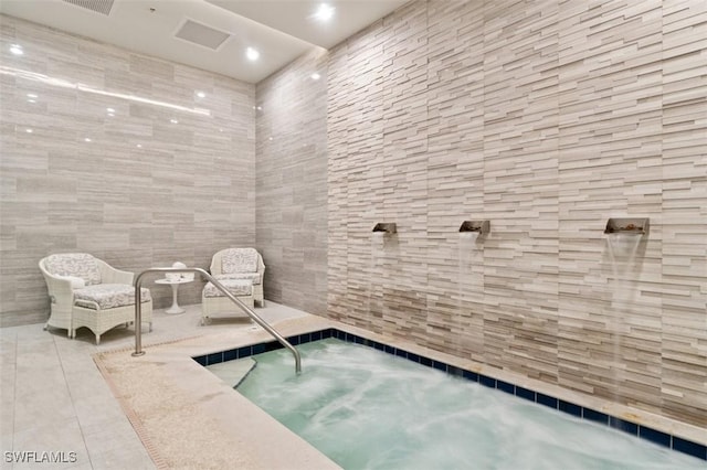 605 El Camino Real Unit 102, Naples, FL 34119 - view of pool featuring an in-ground hot tub and a swimming pool