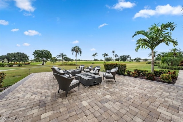 605 El Camino Real Unit 102, Naples, FL 34119 - view of patio featuring an outdoor fire pit and view of golf course