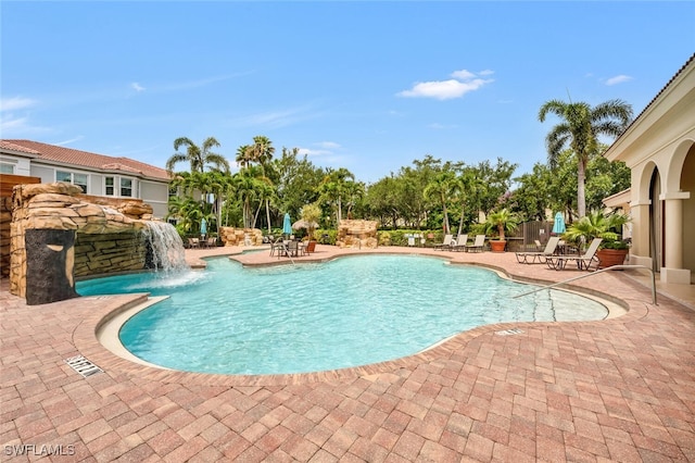 605 El Camino Real Unit 102, Naples, FL 34119 - community pool featuring a patio area