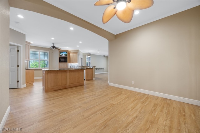 13644 Gulfbreeze St, Fort Myers, FL 33907 - kitchen with ceiling fan, light wood-type flooring, a kitchen island, recessed lighting, and crown molding