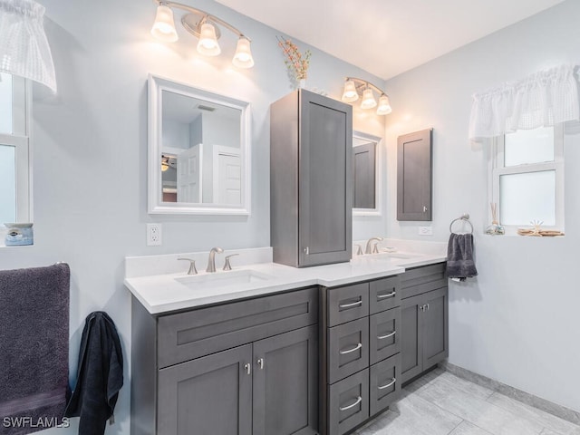 242 Angler Ct, Marco Island, FL 34145 - full bath with double vanity and baseboards