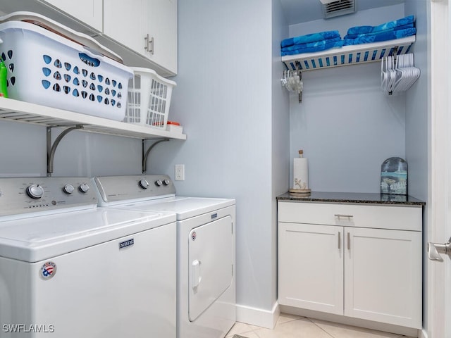 242 Angler Ct, Marco Island, FL 34145 - laundry room featuring independent washer and dryer, cabinet space, and light tile patterned floors