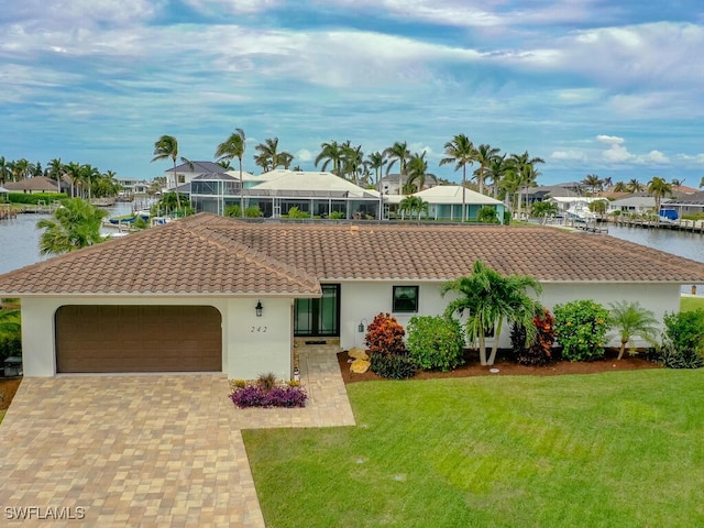 242 Angler Ct, Marco Island, FL 34145 - single story home with a tile roof, a garage, a front lawn, and stucco siding