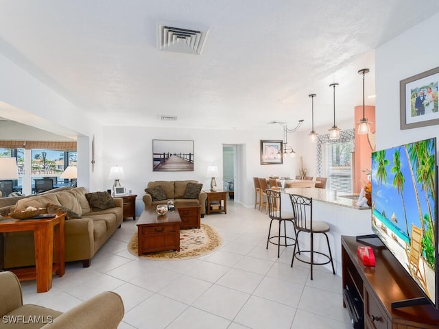 242 Angler Ct, Marco Island, FL 34145 - living room with plenty of natural light and light tile patterned floors