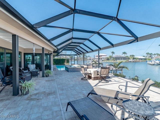242 Angler Ct, Marco Island, FL 34145 - view of patio with glass enclosure, a water view, outdoor lounge area, and a pool with connected hot tub