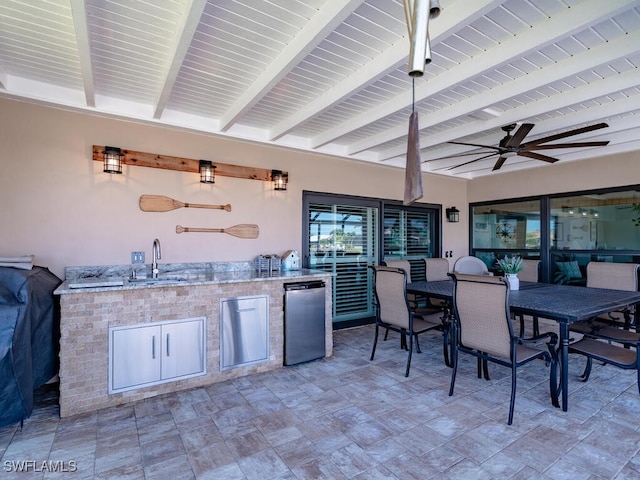 242 Angler Ct, Marco Island, FL 34145 - view of patio / terrace with a sink, ceiling fan, an outdoor kitchen, and outdoor dining space
