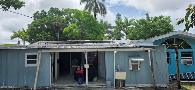 2027 44th St SW, Naples, FL 34116 - view of side of property with cooling unit and board and batten siding