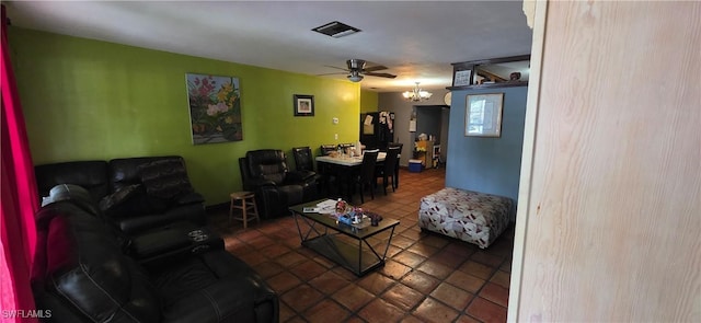 2027 44th St SW, Naples, FL 34116 - tiled living area with a ceiling fan and a chandelier