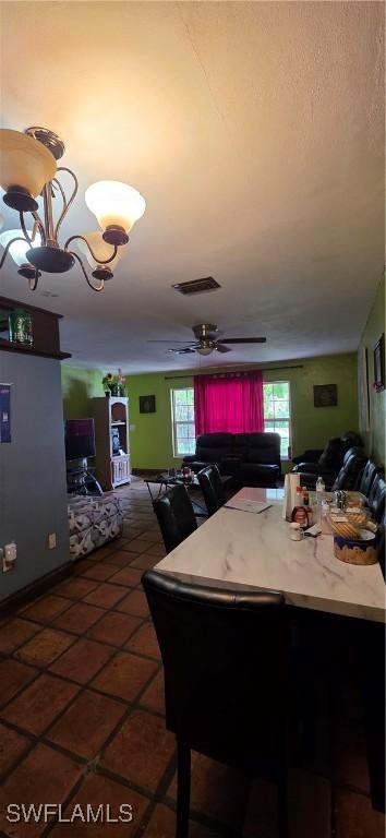 2027 44th St SW, Naples, FL 34116 - tiled dining area featuring plenty of natural light and a ceiling fan