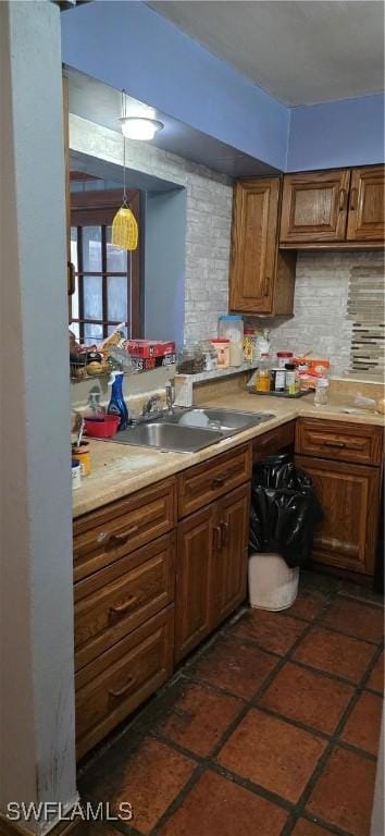 2027 44th St SW, Naples, FL 34116 - kitchen with a sink, light countertops, backsplash, and brown cabinets