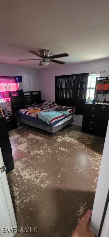 2027 44th St SW, Naples, FL 34116 - bedroom with concrete floors and a ceiling fan