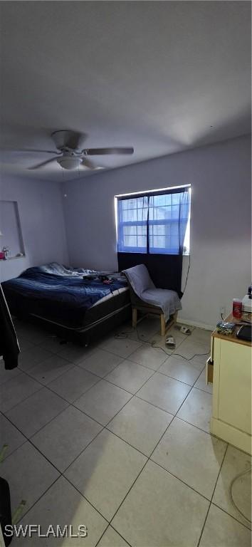 2027 44th St SW, Naples, FL 34116 - bedroom featuring light tile patterned floors and ceiling fan