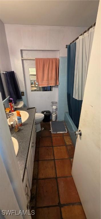 2027 44th St SW, Naples, FL 34116 - bathroom featuring vanity, toilet, tile patterned floors, and shower / tub combo