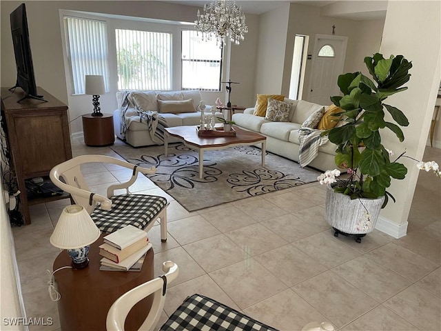 260 29th St SW, Naples, FL 34117 - tiled living area with baseboards and a chandelier