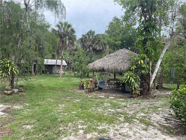 260 29th St SW, Naples, FL 34117 - view of grassy yard with a gazebo and a patio