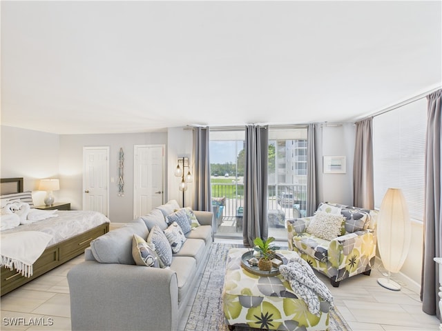 5600 Bonita Beach Rd Unit 201, Bonita Springs, FL 34134 - bedroom featuring two closets and access to exterior