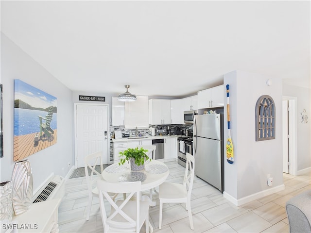 5600 Bonita Beach Rd Unit 201, Bonita Springs, FL 34134 - dining area featuring baseboards