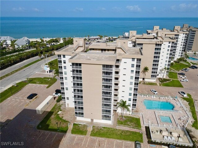 5600 Bonita Beach Rd Unit 201, Bonita Springs, FL 34134 - bird's eye view of apartment complex / building, a nearby body of water, and a pool area