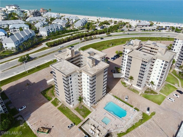 5600 Bonita Beach Rd Unit 201, Bonita Springs, FL 34134 - drone / aerial view of waterfront with a beach and a pool