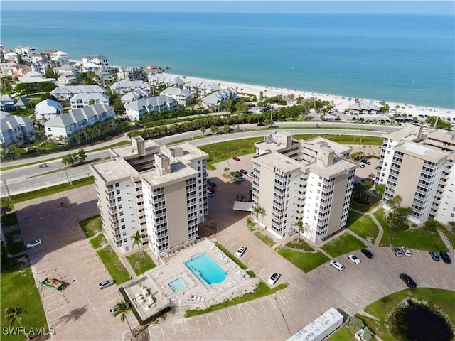 5600 Bonita Beach Rd Unit 201, Bonita Springs, FL 34134 - drone / aerial view of a pool area, a large body of water, and apartment complex / building