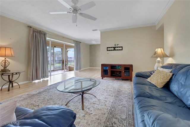 1155 Sandpiper St Unit D4, Naples, FL 34102 - living area featuring crown molding, a ceiling fan, and wood finished floors