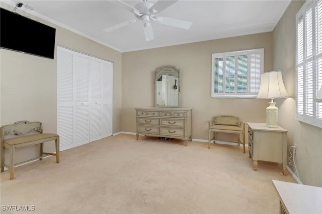1155 Sandpiper St Unit D4, Naples, FL 34102 - living area featuring healthy amount of natural light, carpet floors, ceiling fan, and ornamental molding