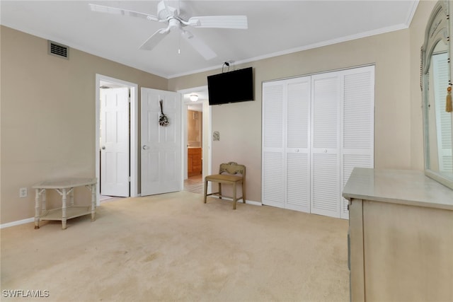 1155 Sandpiper St Unit D4, Naples, FL 34102 - unfurnished bedroom featuring light carpet, ornamental molding, a closet, and ceiling fan