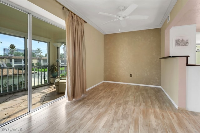 1155 Sandpiper St Unit D4, Naples, FL 34102 - empty room with hardwood / wood-style floors, ceiling fan, and crown molding