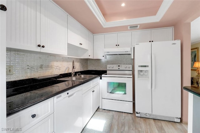 1155 Sandpiper St Unit D4, Naples, FL 34102 - kitchen featuring white appliances, under cabinet range hood, a raised ceiling, dark countertops, and recessed lighting