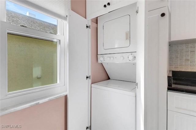 1155 Sandpiper St Unit D4, Naples, FL 34102 - laundry area with stacked washer / drying machine