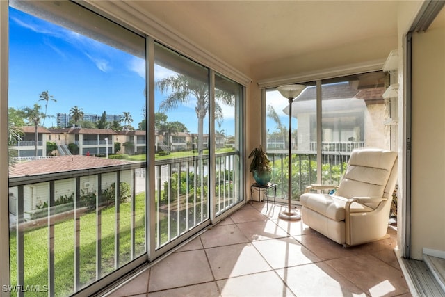 1155 Sandpiper St Unit D4, Naples, FL 34102 - sunroom / solarium featuring a water view, tile patterned flooring, floor to ceiling windows, and a residential view