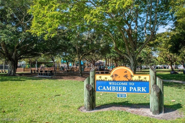 1155 Sandpiper St Unit D4, Naples, FL 34102 - surrounding community with a lawn