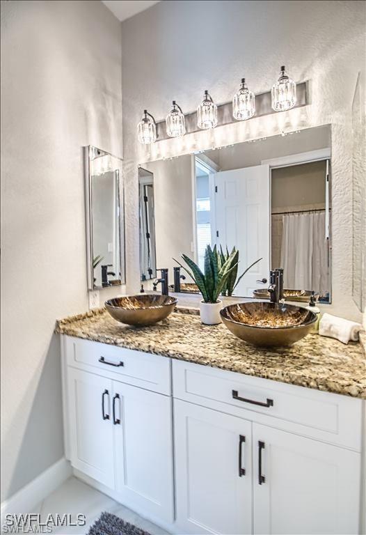 623 SW 56th St, Cape Coral, FL 33914 - full bathroom with double vanity