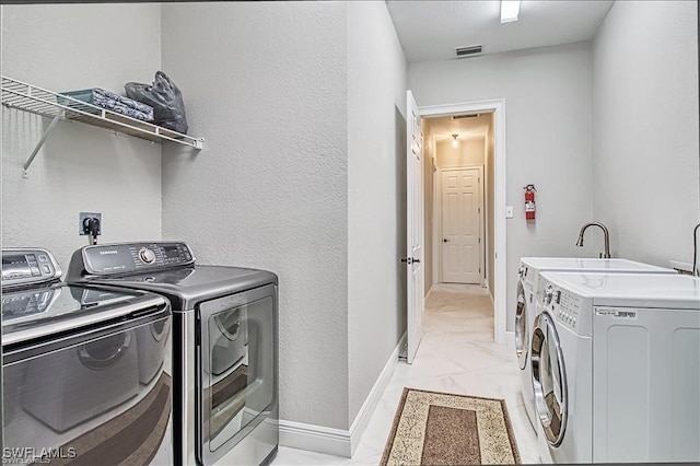 623 SW 56th St, Cape Coral, FL 33914 - laundry room with independent washer and dryer and baseboards
