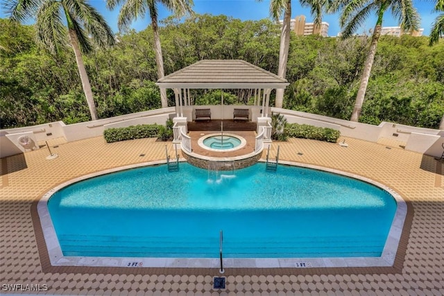 315 Dunes Blvd Unit 1006, Naples, FL 34110 - community pool with a gazebo, a community hot tub, and a patio area