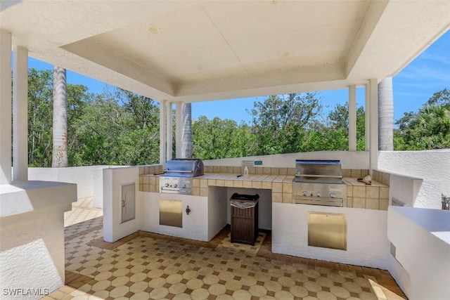 315 Dunes Blvd Unit 1006, Naples, FL 34110 - view of patio / terrace featuring view of scattered trees