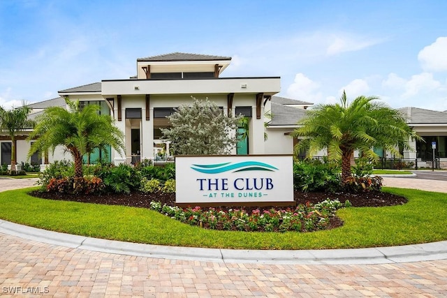 315 Dunes Blvd Unit 1006, Naples, FL 34110 - community / neighborhood sign with decorative driveway and a lawn