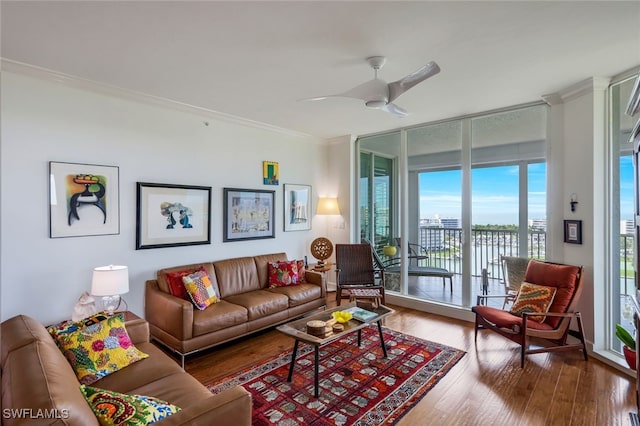 315 Dunes Blvd Unit 1006, Naples, FL 34110 - living area featuring crown molding, wood finished floors, and ceiling fan