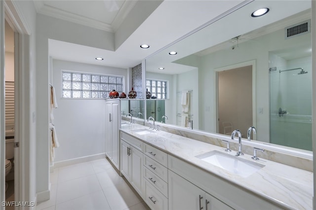 315 Dunes Blvd Unit 1006, Naples, FL 34110 - bathroom with double vanity, recessed lighting, ornamental molding, toilet, and tile patterned flooring