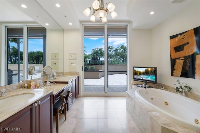 1050 Borghese Ln Unit 106, Naples, FL 34114 - bathroom with double vanity, a chandelier, a jetted tub, recessed lighting, and tile patterned flooring