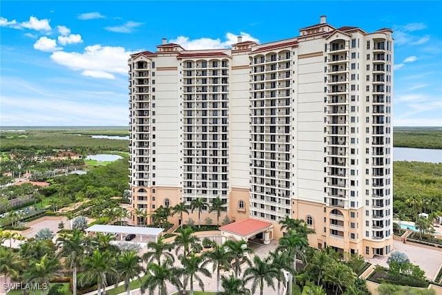1050 Borghese Ln Unit 106, Naples, FL 34114 - view of apartment building / complex featuring a water view