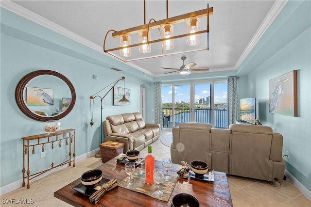 2745 1st St Unit 801, Fort Myers, FL 33916 - living area with light tile patterned floors, ornamental molding, ceiling fan, baseboards, and a raised ceiling