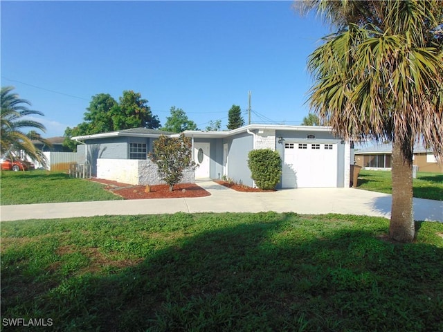 100 Waterview Ave, Lehigh Acres, FL 33936 - ranch-style home featuring an attached garage, a front lawn, concrete driveway, and stucco siding